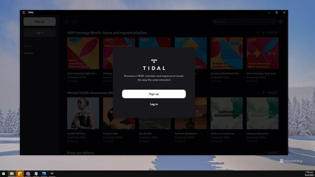 TIDAL desktop app welcome screen with Log in and Sign up controls